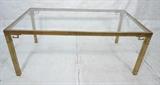 Lot 534:  MASTERCRAFT (attribution) Dining Table. Brass frame with Greek key corners. Inset glass top.: Dimensions:  H: 29 inches: W: 71 inches: D: 39.25 inches --- 
