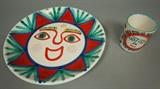 Lot 32:  2pc DeSIMONE Italian Art Pottery Lot. Large Charger with Sun Design. Cylindrical Sun design Vase/Holder.  All marked.: Dimensions:  H: 14.75 inches: W: 14.75 inches --- US Shipping charge: $35