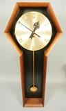 Lot 431:  Modern American Modern Walnut Case Wall Clock. Brass Face. : Dimensions:  H: 35.5 inches: W: 16 inches: D: 4 inches --- 