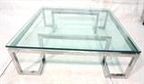 Lot 603:  Large Modernist Chrome & Glass Coffee Table. 3/4" thick floating glass top on chrome base with inverted corner base. Thick square chrome tube frame: Dimensions:  H: 16 inches: W: 48 inches: D: 48 inches --- 