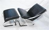 Lot 612:  Chrome Lounge Chair & Ottoman. Black leather. Heavy solid chrome frames in "Y" Form. Sloped ottoman. Italian style. : Dimensions:  H: 35.5 inches: W: 26 inches: D: 34 inches --- 