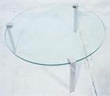 Lot 620:  Round Glass Coffee Table with Three Chrome Legs. Glass fits into 3 wide flat chrome legs. Made in Italy sticker: Dimensions:  H: 42.5 inches: W: 42.5 inches --- 