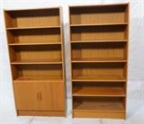 Lot 627:  2pc Danish Modern Teak Tall Wall Shelves Bookcases. One with lower 2 door cabinet.: Dimensions:  H: 75 inches: W: 35.5 inches: D: 11 inches --- 