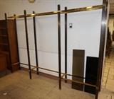 Lot 633:  Large Metal and Glass Etagere wall Unit. Smoked glass shelves. Two tone brass uprights.: Dimensions:  H: 83 inches: W: 114 inches: D: 14 inches --- 