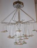Lot 636:  Italian LUCCIOLE/LAMP Hanging Chandelier. Modern Futurist Metal rod frame. Frosted colored glass discs are suspended from metal wire. : Dimensions:  H: 37 inches: W: 34 inches: D: 34 inches --- 
