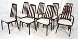 Lot 652:  Set 8 SVEGARDS Rosewood Finish Dining Chairs. Tall back slatted Frames. Two Arm Chairs. White damask fabric. Possibly teak. Marked. : Dimensions:  H: 37.5 inches: W: 19 inches: D: 17 inches --- 