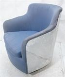 Lot 654:  MILO BAUGHMAN Chrome Barrel Back Lounge Chair. Blue upholstery. Chrome frame and base swivel chair.: Dimensions:  H: 30 inches: W: 29 inches: D: 26 inches --- 