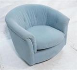 Lot 655:  SELIG Barrel Back Lounge Chair. Light blue upholstery. Wood base swivel chair. Selig  Monroe tag: Dimensions:  H: 29 inches: W: 33 inches: D: 32 inches --- 