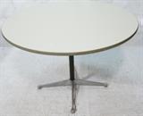 Lot 656:  HERMAN MILLER Round Laminate Top Dining Table. Black pedestal with four aluminum feet. Gray rubber trim. Herman Miller black tag.: Dimensions:  H: 28.75 inches: W: 40 inches: D: 40 inches --- 