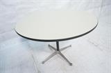 Lot 658:  HERMAN MILLER Round Laminate Top Dining Table. Black pedestal with four aluminum feet. Dark gray rubber trim: Dimensions:  H: 28.75 inches: W: 41 inches: D: 41 inches --- 