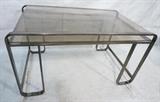Lot 662:  Two Level Glass & Metal  Modern Desk. Dark metallic finish frame. Smoked glass. : Dimensions:  H: 29 inches: W: 55 inches: D: 33 inches --- 