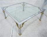 Lot 695:  Decorator Square Coffee Cocktail Table. Legs have three chrome rods with brass trim & accents. : Dimensions:  H: 16.25 inches: W: 36 inches: D: 36 inches --- 