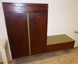 Lot 703:  2pc Modern Wall Mounted Cabinets. Dark wood with green trim accents. : Dimensions:  H: 44 inches: W: 63 inches: D: 18.25 inches --- 