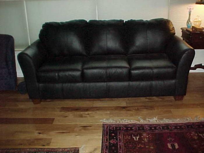 Black leather couch, like new.