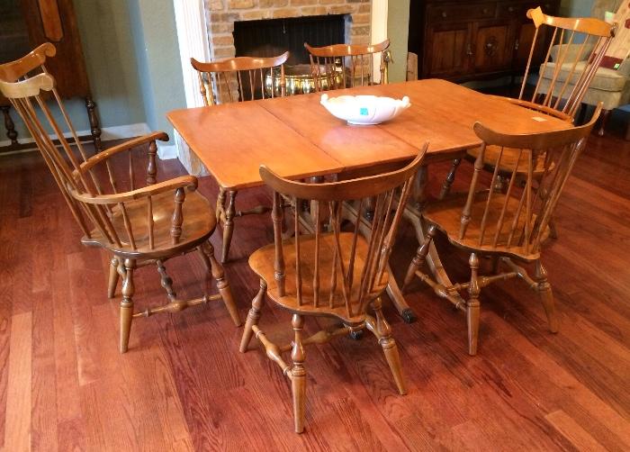 Hard rock maple drop leaf table and six maple chairs..