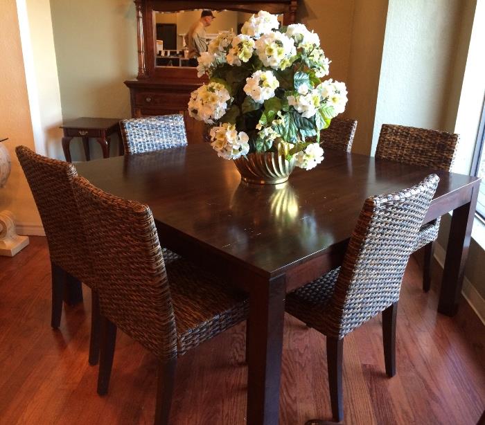 Gorgeous square dining table with six rush chairs.
