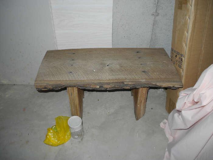 Primitive bench from one solid piece of wood