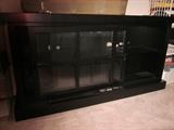 Fourth stacking cabinet, used as a tv stand.