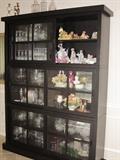 Stacking display cabinets with sliding doors. They are separate pieces you arrange how you wish. Total of four cabinets in the house.