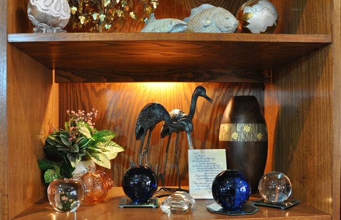 Large glass paperweights, stylish herons and a very attractive vase.