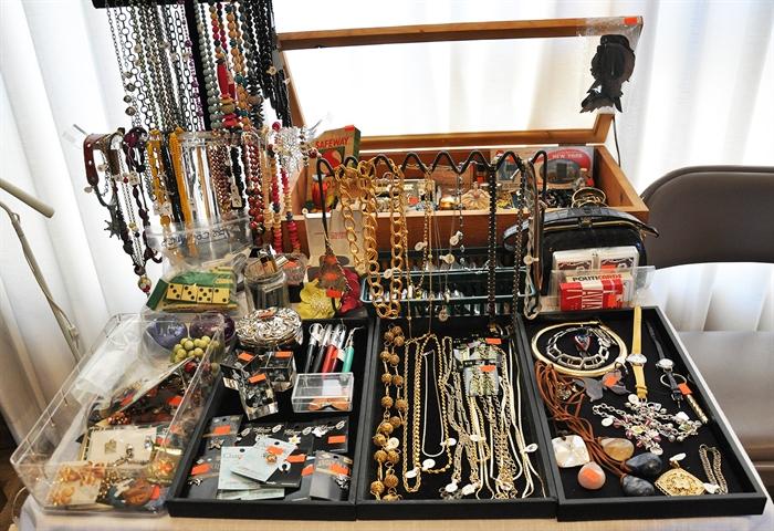 This is the small treasure and jewelry area.  One will find a sterling compact, old fountain pens, a baby alligator purse, political playing cards, to name a few