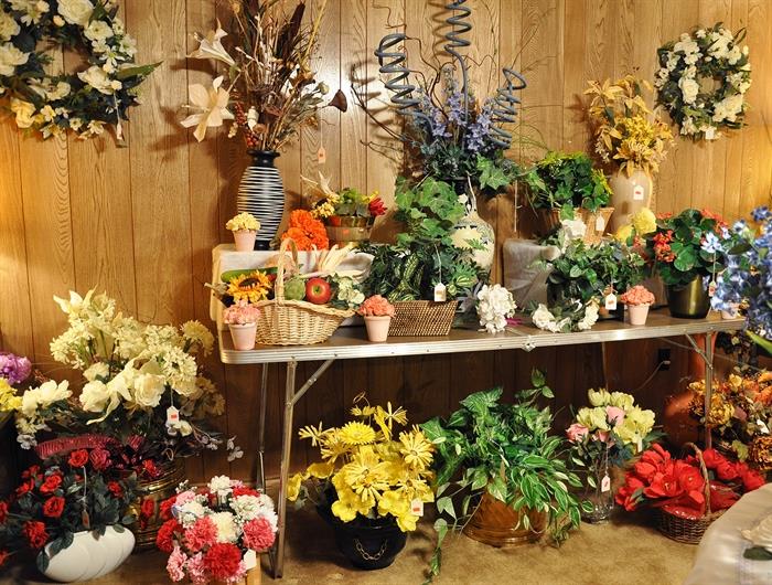 You must visit our "flower shoppe" filled with designer arrangements, other arrangements, wreaths and swags.  There are also lots of single stems of florals and greenery to create your own.  We also have baskets and vases for your own creations.