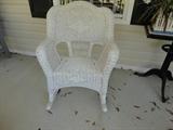 One of two wicker porch rockers