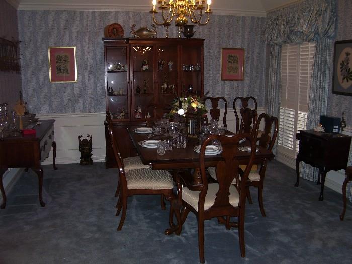 Dinning room table has 2 leaves, eight dining chairs, china cabinet & buffet. Draperies are for sale. 