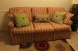 Ashley Laura (Lazy Boy) couch in beautiful colors of red, yellow, and green.  In excellent condition.  Would be a great couch for a sun room also.
