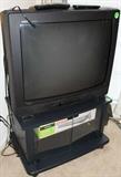 TV with TV stand.  Has brand new VCR and CD player.