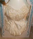 A beautiful wedding dress in preserved box.  Has lots of beautiful beading and fitted waist.
