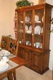 Close-up of the china cabinet that matches the dining room suite.