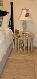 White bambo end table with glass top. Crystal lamp on end table.