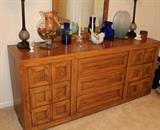Close-up of walnut dresser with long mirror and several drawers. Solid wood.