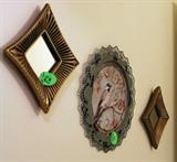 Mirrors and the green metal bird hanging in bath.