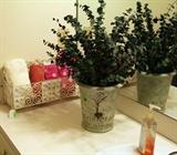 White metal stand with hand towels in bath.