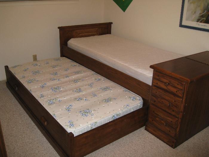 Trundle twin bed set with storage footboard and matching dresser