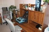 Computer desk with hutch, office supplies and chairs, electric typewriter, and more