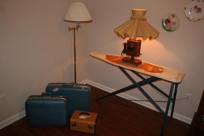 Antique telephone lamp, 1950s ironing board, suitcases, floor lamp, Bavarian plates