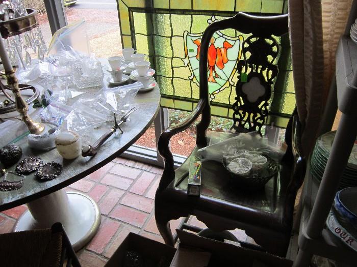 Several stain glass pieces and antique chairs