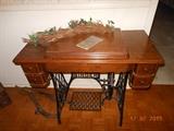 Antique Singer in cabinet