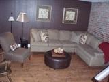 Leather ottoman and sectional with fabric warranty as well as arm less chair and antique rocker