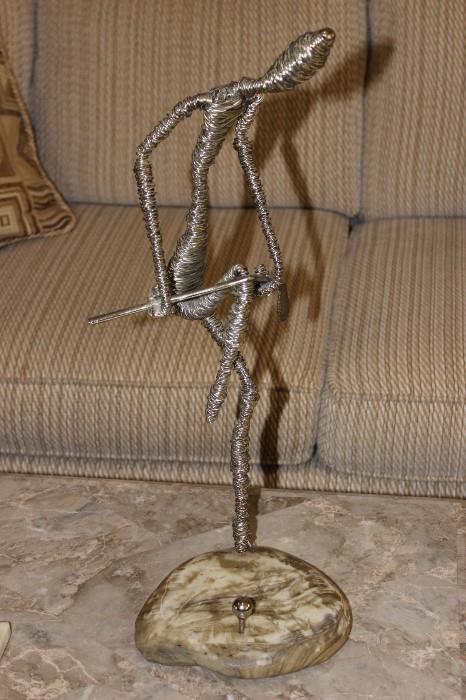 Wrapped wire golf figure.