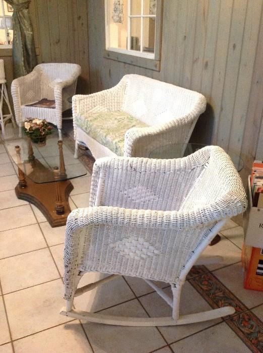 Wicker rocking chair, settee, and matching chair