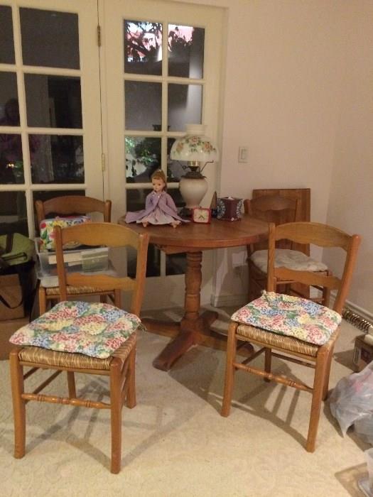 Small kitchen table and 4 chairs, wood, woven straw seats