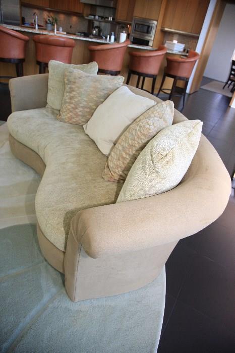 There are three matching down filled sofas are available to be sold separately.  When placed together they for a circle.