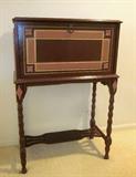 Antique, drop-front, writing desk with drawers, spindle legs and small fretwork shelf.  Has been painted and mirror applied inside.