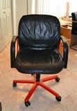 Pair of leather executive chairs with red bases (Merchandise Mart)
