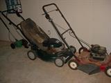 Several mowers, edgers, electric trimmers, blowers, and more