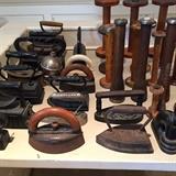Antique wooden spools, antique iron collection.